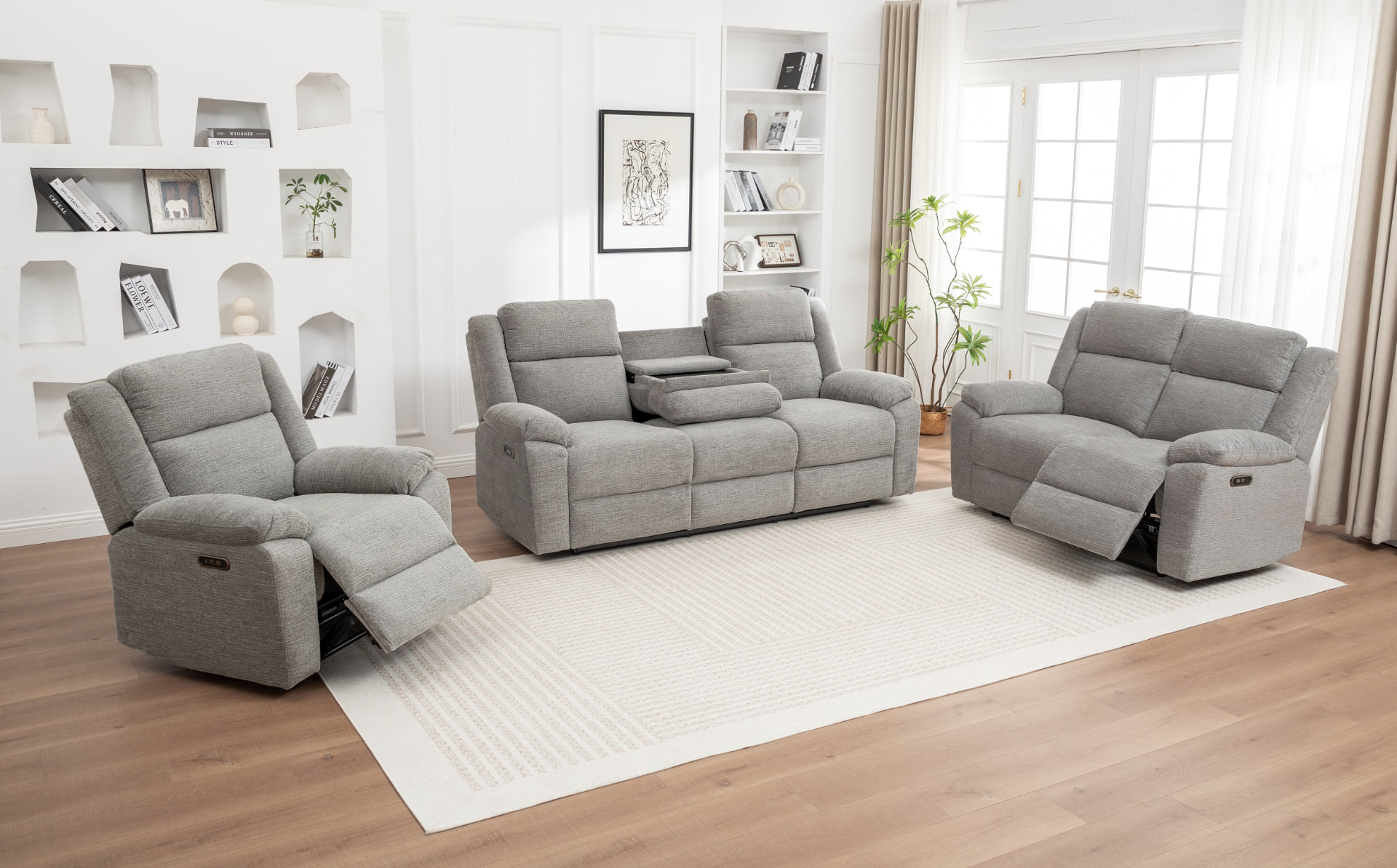 Grey recliner lounge suite in a bright living room